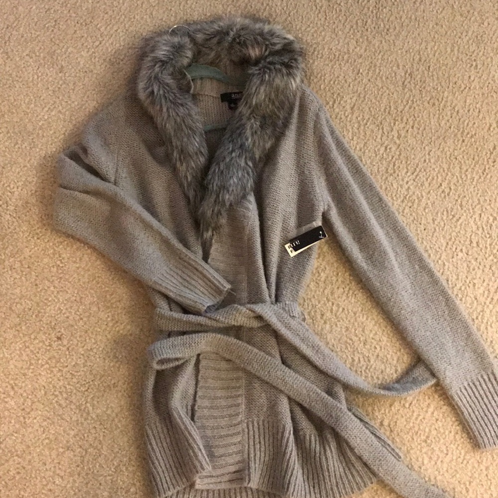 Long sweater with faux fur detail